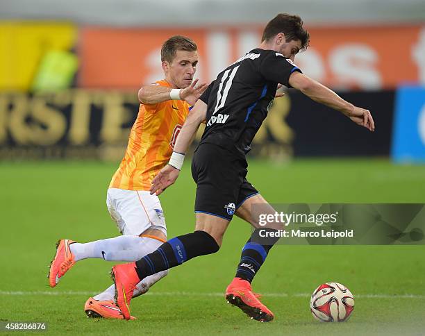 Peter Pekarik of Hertha BSC and Moritz Stoppelkamp of SC Paderborn 07 during the game between SC Paderborn 07 against Hertha BSC on november 2, 2014...