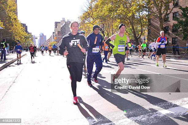 Amy Brooks runs her leg in the 2014 NBA All-Star Relay during the TCS NYC Marathon on November 2, 2014 in New York City. NOTE TO USER: User expressly...
