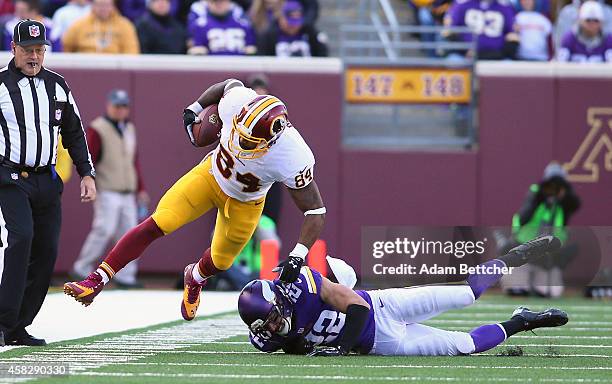 Niles Paul of the Washington Redskins gets knocked out of bounds by Harrison Smith of the Minnesota Vikings during the second quarter on November 2,...