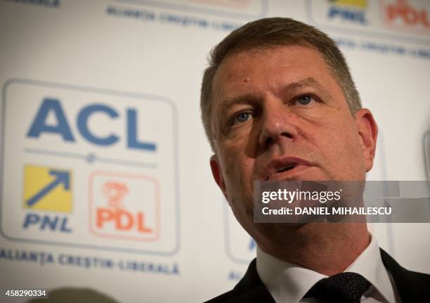 Opposition presidential candidate Klaus Iohannis addresses the media during a press conference after exit polls on November 2, 2014. Prime minister...