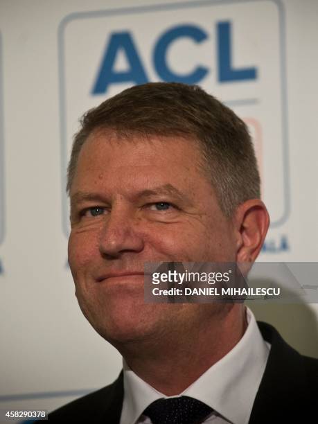 Opposition presidential candidate Klaus Iohannis addresses the media during a press conference after exit polls on November 2, 2014. Prime minister...