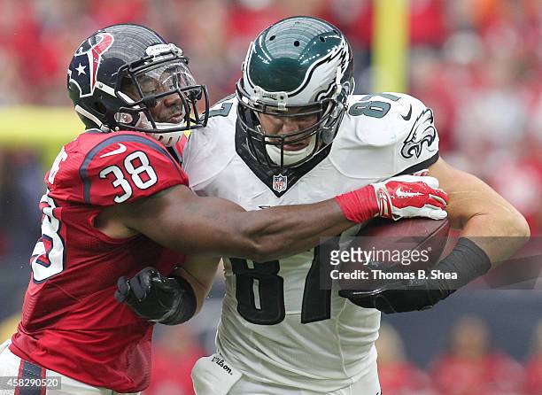 Brent Celek of the Philadelphia Eagles is tackled by Danieal Manning of the Houston Texans in the second quarter in a NFL game on November 2, 2014 at...