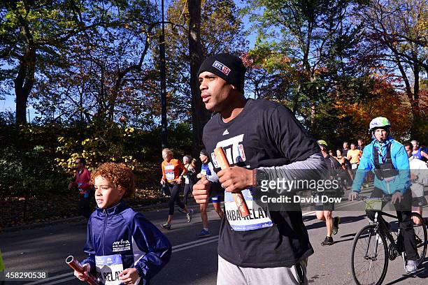 Former NBA Player Allan Houston runs his leg in the 2014 NBA All-Star Relay at the TSC New York City Marathon on November 2, 2014 in New York City....