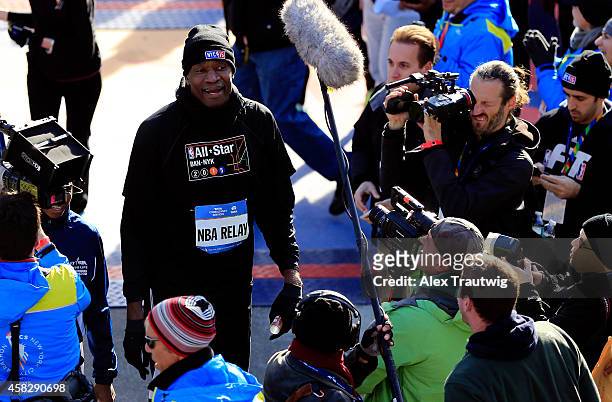 Former NBA player Dikembe Mutombo looks on after crossing the finish line of the 2014 TCS New York City Marathon as part of the NBA relay team on...
