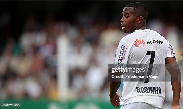 Robinho of Santos looks on during the match between Santos and Internacional for the Brazilian Series A 2014 at Vila Belmiro Stadium on November 2,...