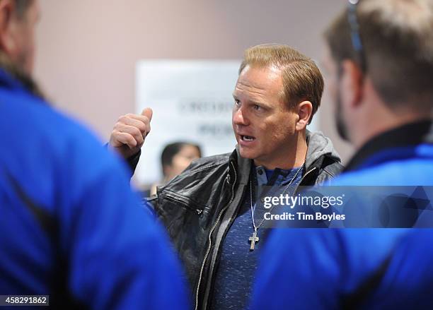 Nik Wallenda talks with his crew in the final hours before his record-breaking high wire walk along the skyline on November 2, 2014 in Chicago,...