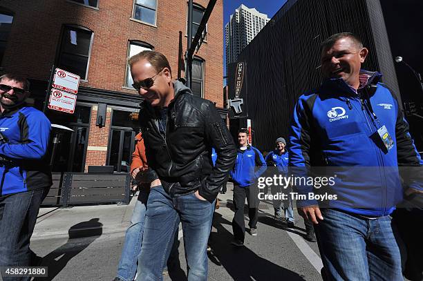 Nik Wallenda laughs as he walks to the production office with part of his crew in the hours before his record-breaking high wire walk along the...