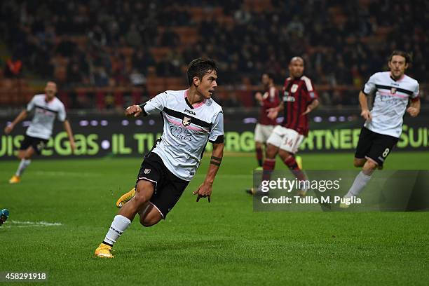 Paulo Dybala of Palermo celebrates after scoring his team's second goal during the Serie A match between AC Milan and US Citta di Palermo at Stadio...