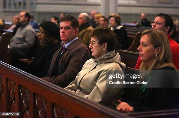 In attendance are Mayor Martin J. Walsh, his mother Mary Walsh and girlfriend Lorrie Higgins, right. A memorial Mass for former mayor Thomas M....