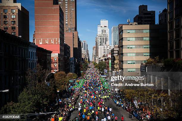 Runners run up First Avenue as seen from the 59th Street Bridge during the TCS New York City Marathon on November 2, 2014 inof New York City.