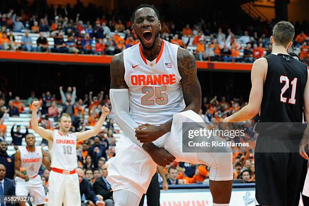 Rakeem Christmas of the Syracuse Orange reacts to a dunk against the Carleton Ravens during the second half at the Carrier Dome on November 2, 2014...