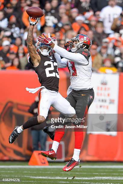 Cornerback Joe Haden of the Cleveland Browns breaks up a pass intended for wide receiver Mike Evans of the Tampa Bay Buccaneers during the first half...