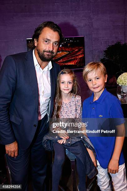 Former Tennis player Henri Leconte and his children attend the Final match during day 7 of the BNP Paribas Masters. Held at Palais Omnisports de...
