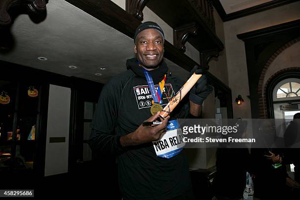 Dikembe Mutombo finishes the last leg of the TCS New York City Marathon as part of the NBA All-Star Relay Team on November 2, 2014 in New York, New...