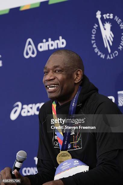 Former NBA player Dikembe Mutombo speaks to the media after they finish the last leg of the TCS New York City Marathon as part of the NBA All-Star...