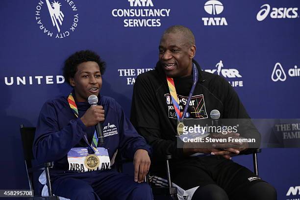 Former NBA player Dikembe Mutombo and Jontai Williams speak to the media after they finish the last leg of the TCS New York City Marathon as part of...