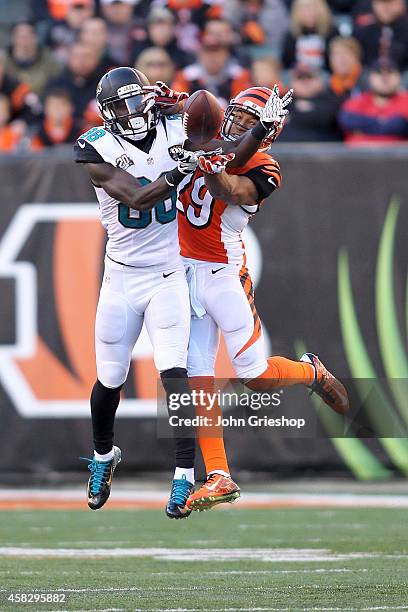Leon Hall of the Cincinnati Bengals attempts to break up a pass for Allen Hurns of the Jacksonville Jaguars during the fourth quarter at Paul Brown...