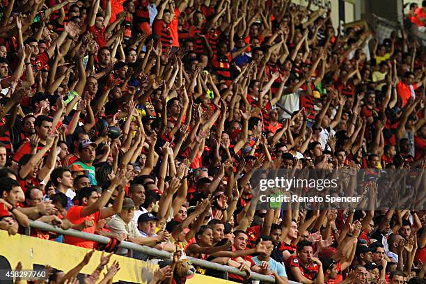 Fans of Sport Recife celebrate a pelnaty during the Brasileirao Series A 2014 match between Sport Recife and Figueirense at Ilha do Retiro Stadium on...