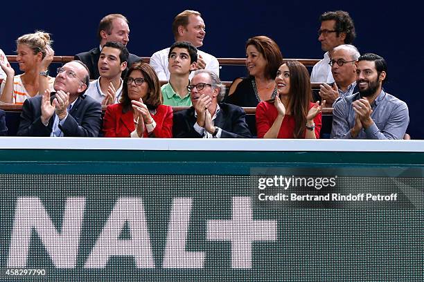 Pierre Gattaz, Michel Leeb and his wife Beatrice, singer Sofia Essaidi and her companion attend the Final match during day 7 of the BNP Paribas...