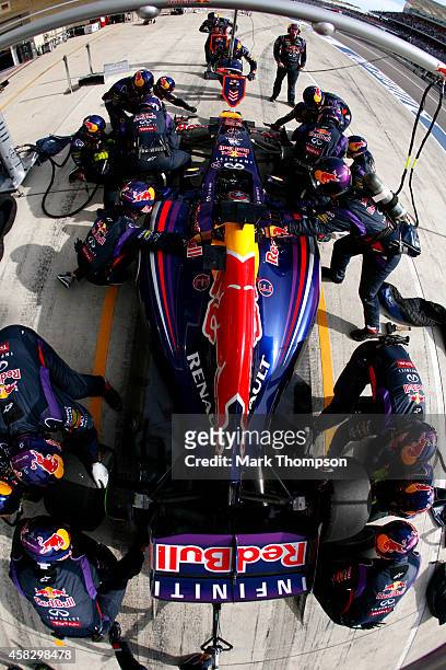 Sebastian Vettel of Germany and Infiniti Red Bull Racing makes a pit stop during the United States Formula One Grand Prix at Circuit of The Americas...