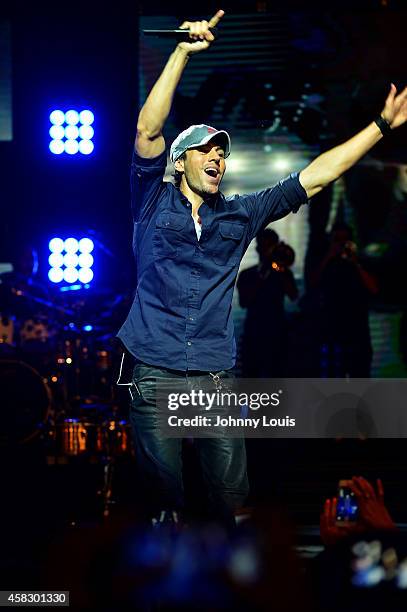 Enrique Iglesias perform with Gente De Zona at James L Knight Center on November 1, 2014 in Miami, Florida.