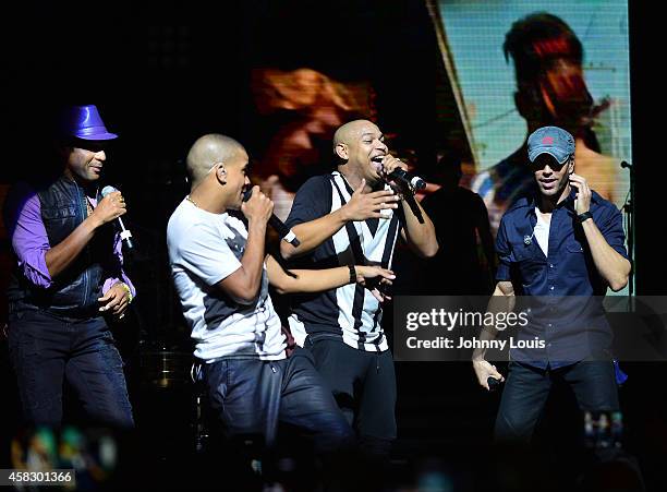 Gente De Zona, Descemer Bueno and Enrique Iglesias perform at James L Knight Center on November 1, 2014 in Miami, Florida.