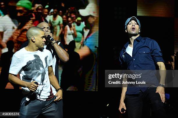 Gente De Zona and Enrique Iglesias perform at James L Knight Center on November 1, 2014 in Miami, Florida.