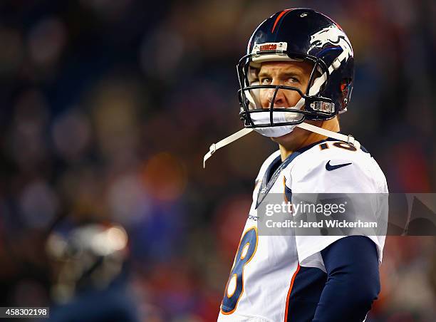 Peyton Manning of the Denver Broncos reacts during the fourth quarter against the New England Patriots at Gillette Stadium on November 2, 2014 in...