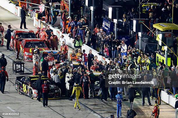 Jeff Gordon, driver of the Drive To End Hunger Chevrolet, walks to confront Brad Keselowski, driver of the Miller Lite Ford, following the NASCAR...