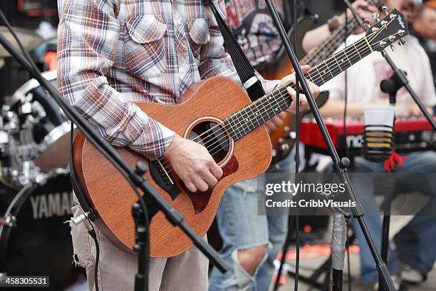 guitarist and band play outside hank's saloon in brooklyn - country music festival stock pictures, royalty-free photos & images