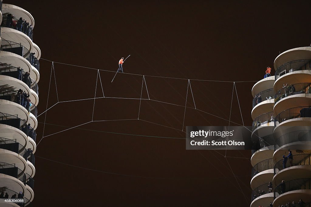 Daredevil Nik Wallenda Walks Across Tightrope In Between Downtown Chicago Buildings