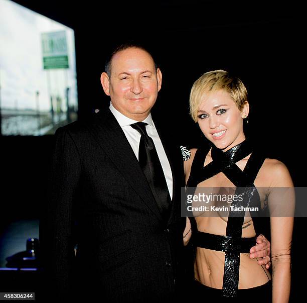 John Dempsey and Miley Cyrus attend amfAR LA Inspiration Gala honoring Tom Ford at Milk Studios on October 29, 2014 in Hollywood, California.