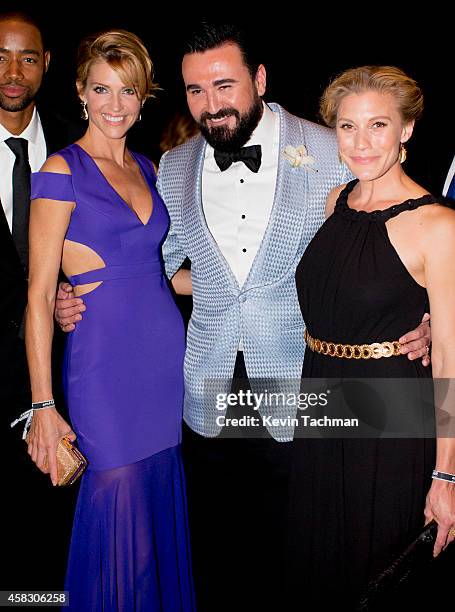 Tricia Helfer, Chris Salgardo and Katie Sackoff attend amfAR LA Inspiration Gala honoring Tom Ford at Milk Studios on October 29, 2014 in Hollywood,...