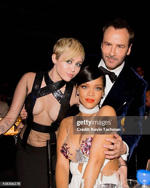 Miley Cyrus , Rihanna and designer Tom Ford attend amfAR LA Inspiration Gala honoring Tom Ford at Milk Studios on October 29, 2014 in Hollywood,...