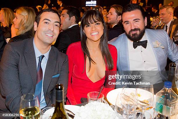 Producer Mohammed Al Turki, Michelle Rodriguez and Chris Salgardo attend amfAR LA Inspiration Gala honoring Tom Ford at Milk Studios on October 29,...