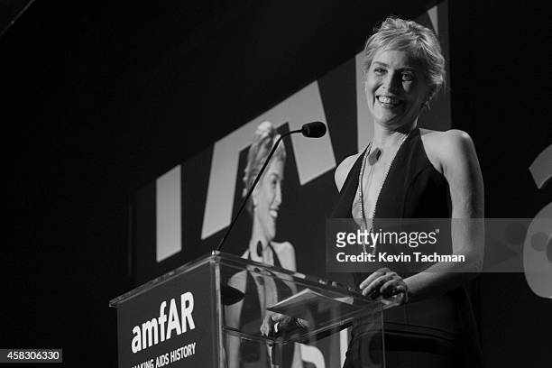 Sharon Stone speaks during the amfAR LA Inspiration Gala honoring Tom Ford at Milk Studios on October 29, 2014 in Hollywood, California.