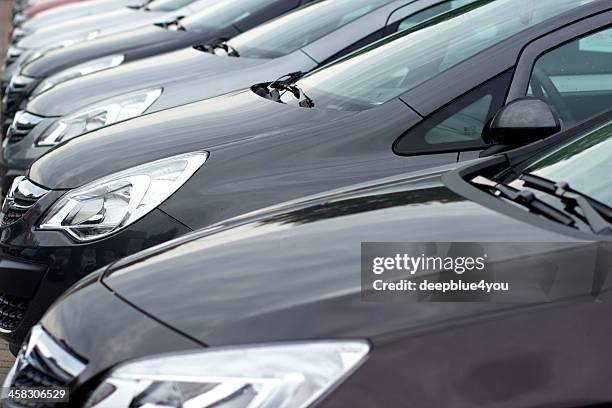 line of new opel compact cars at dealership - opel stock pictures, royalty-free photos & images