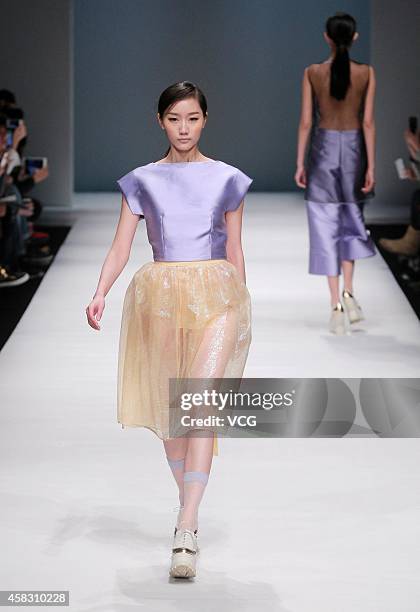 Model showcases designs on the runway at Chicca Lualdi & Alberto Zambelli Collection show during the Mercedes-Benz China Fashion Week Spring/Summer...