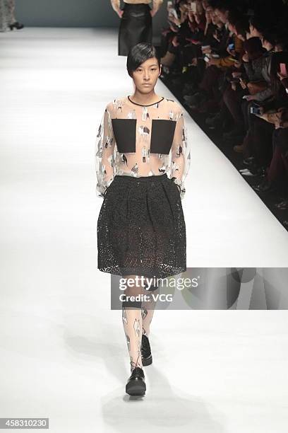 Model showcases designs on the runway at Chicca Lualdi & Alberto Zambelli Collection show during the Mercedes-Benz China Fashion Week Spring/Summer...