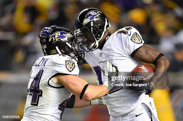 Jacoby Jones of the Baltimore Ravens celebrates his kickoff return for a touchdown with Kyle Juszczyk during the fourth quarter against the...