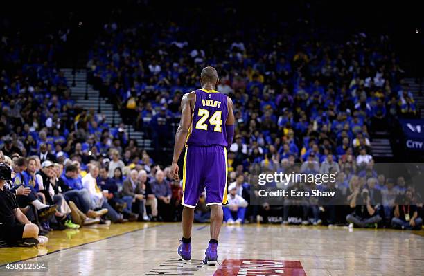 Kobe Bryant of the Los Angeles Lakers walks back down court during their game against the Golden State Warriors at ORACLE Arena on November 1, 2014...