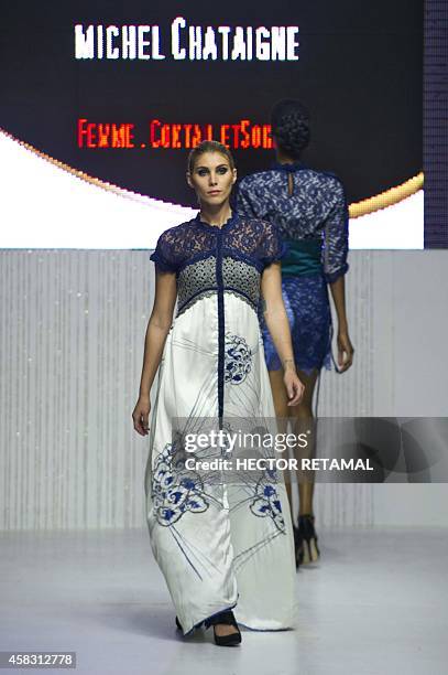 Model presents a creation by designer Michel Chataigne during the last night of the Haiti Fashion Week 2014 held in Port-au-Prince on November 2,...