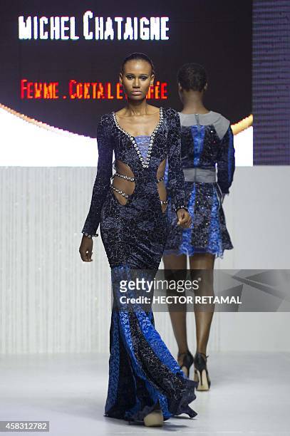 Model presents a creation by designer Michel Chataigne during the last night of the Haiti Fashion Week 2014 held in Port-au-Prince on November 2,...