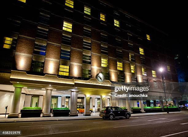 churchill hyatt regency hotel at night, london, uk - entrance sign stock pictures, royalty-free photos & images