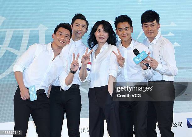 Singer Wang Fei and actor Eddie Peng attend press conference of new movie "Cling To Old Days" directed by Zhang Yibai on November 3, 2014 in Beijing,...