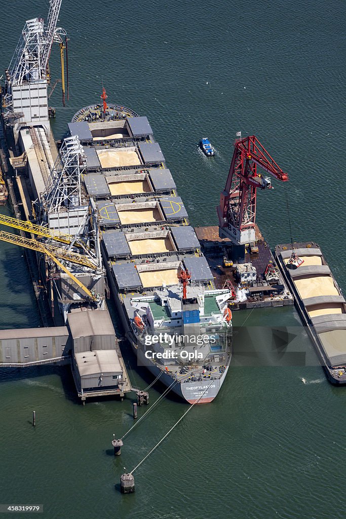 Aerial of Theofylaktos being unloaded by a floating crane