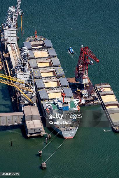 aerial of theofylaktos being unloaded by a floating crane - bulk carrier stock pictures, royalty-free photos & images
