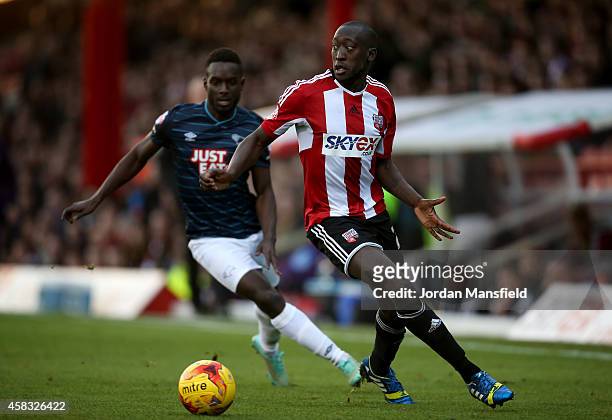 Toumani Diagouraga of Brentford controls the ball under pressure by Simon Dawkins of Derby during the Sky Bet Championship match between Brentford...