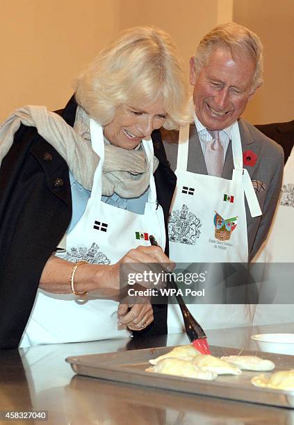Prince Charles, Prince of Wales and Camilla, Duchess of Cornwall make pasties during their visit to the Pasty Museum in Real del Monte on the 'Day of...