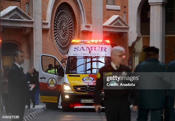 Ambulances carry injured people after fire broke out in a part under construction at Bank of Spain premises in Madrid, Spain on November 03, 2014....